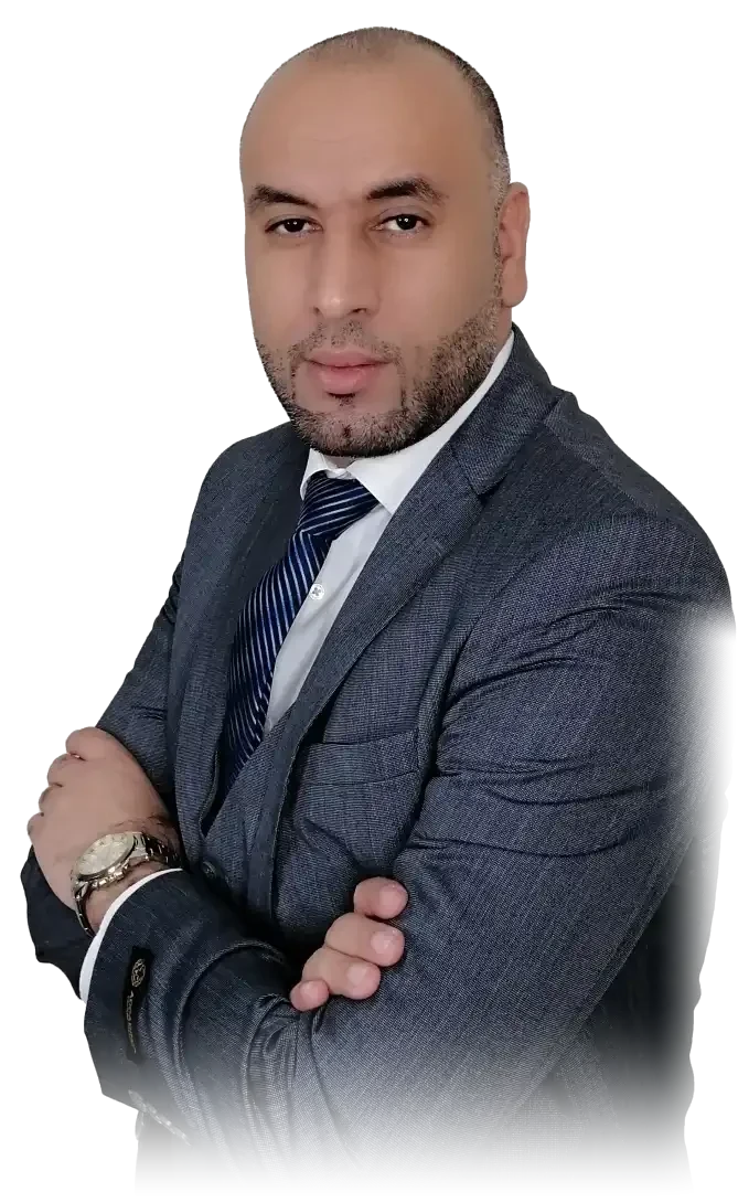The founder of AL TAMAYUZ, arms crossed, in a grey suit