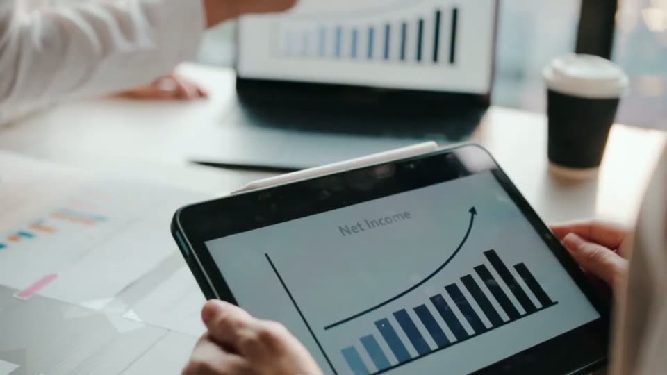 A rising bar chart on a tablet